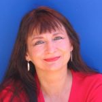 denise linn, woman smiling wearing red with dark hair